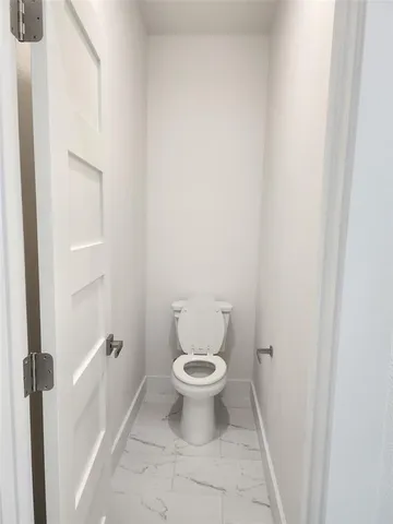 a bathroom with a toilet