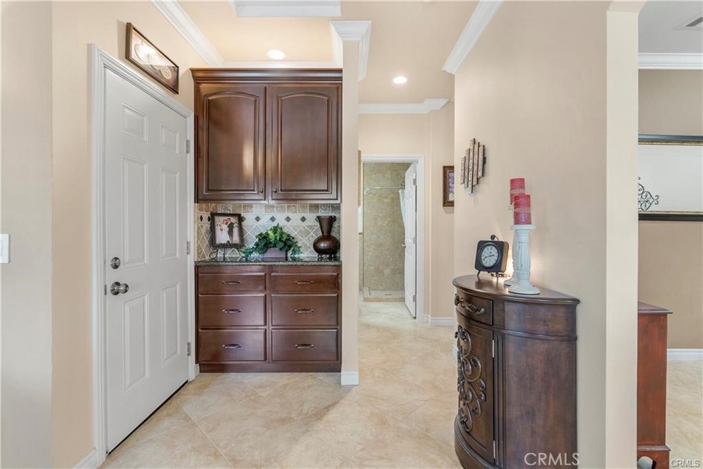 14222 Ashton Lane Riverside, CA 92508 - Photo 4 of 13 a room with cabinets a washer and dryer