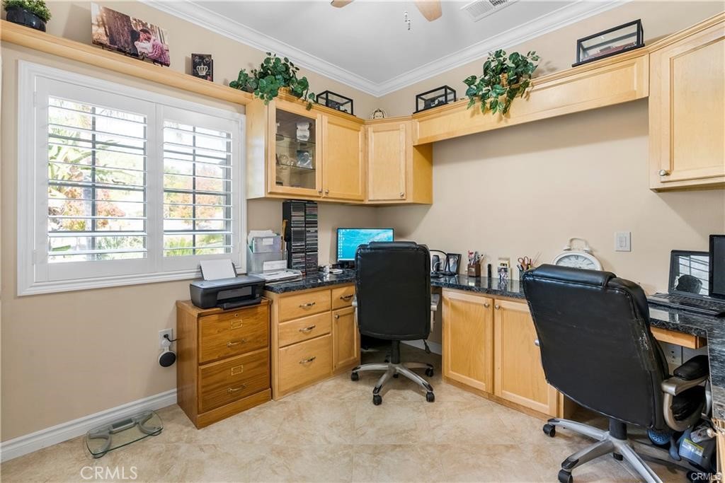 14222 Ashton Lane Riverside, CA 92508 - Photo 8 of 13 a view of a workspace with furniture and a window