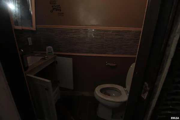 a bathroom with a shower and a sink