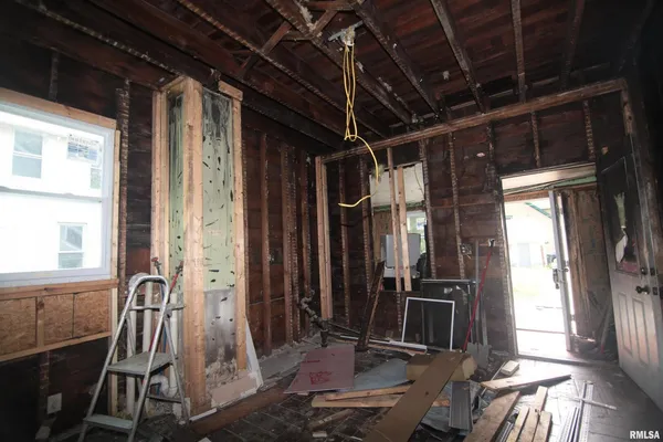 a bathroom with a shower and a sink