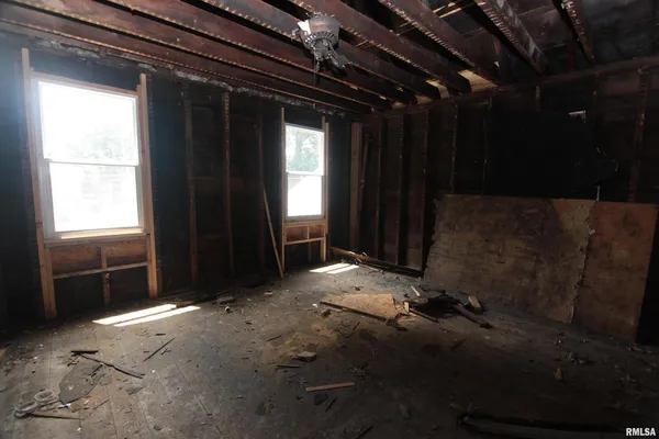 an empty room with windows