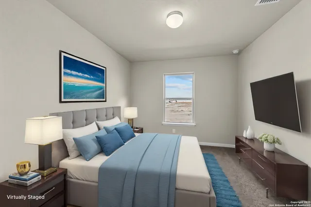 a bedroom with bed and a flat screen tv