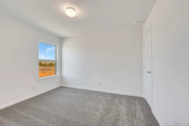 a view of an empty room and window