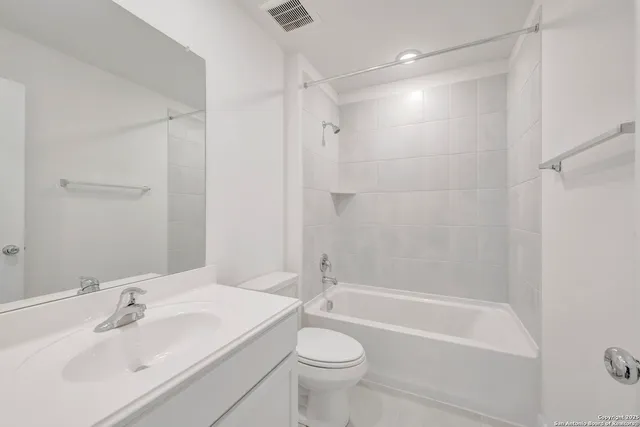 a bathroom with a sink a toilet and a bathtub