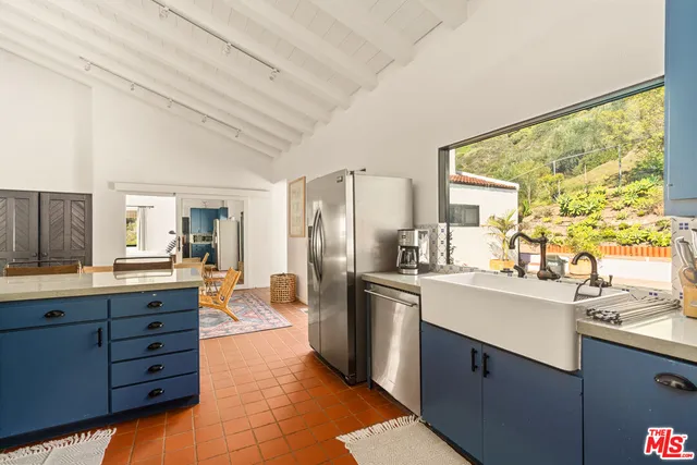 a bedroom with a large bed and a large window