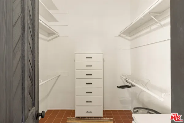 a bathroom with a shower and a sink