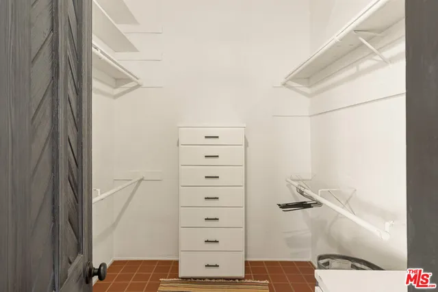 a bathroom with a shower and a sink