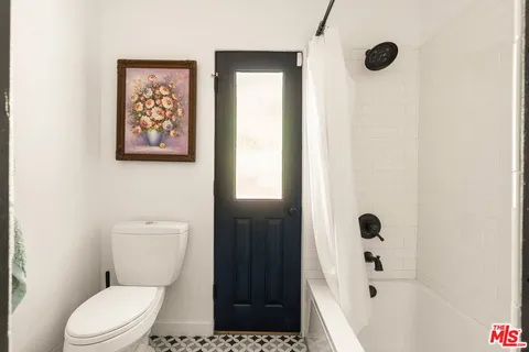 swimming pool view with a seating space and garden view