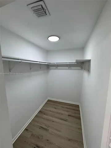 a view of a room with racks on the wall