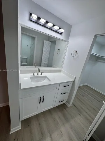 a bathroom with a double vanity sink and mirror