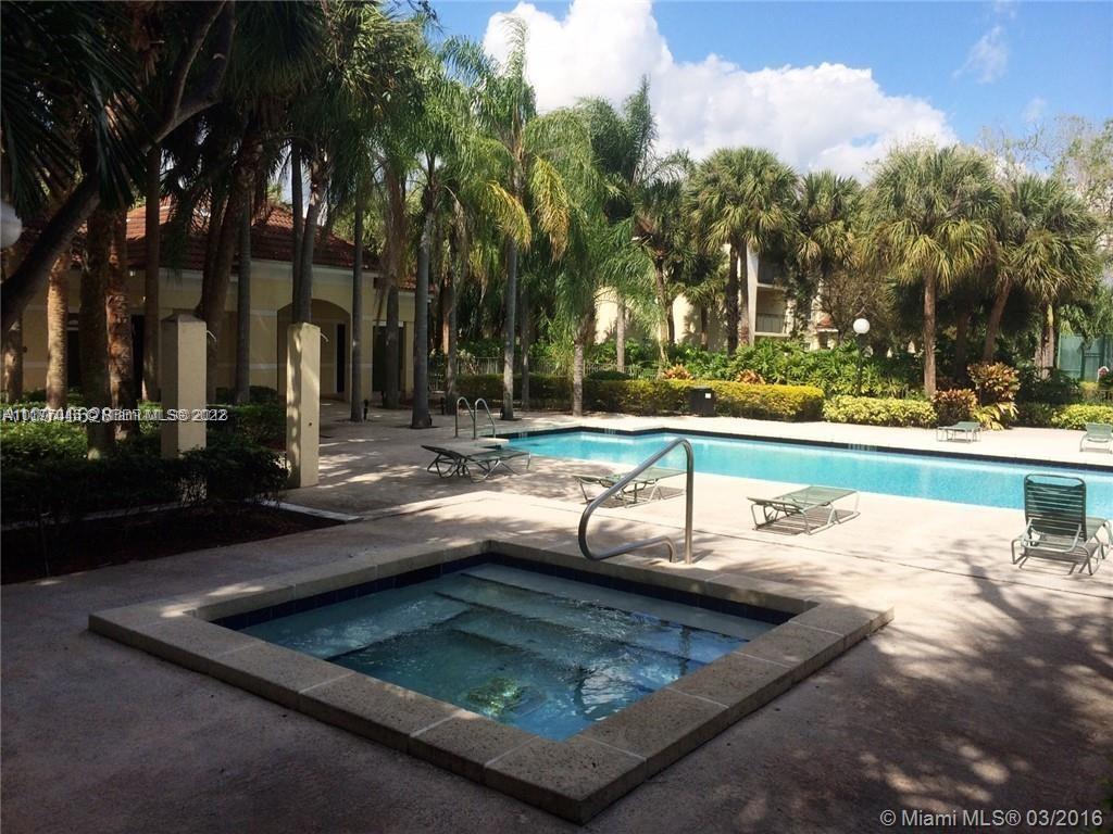 640 South Park Road, Unit 284 Hollywood, FL 33021 - Photo 10 of 12 a view of a swimming pool with a yard