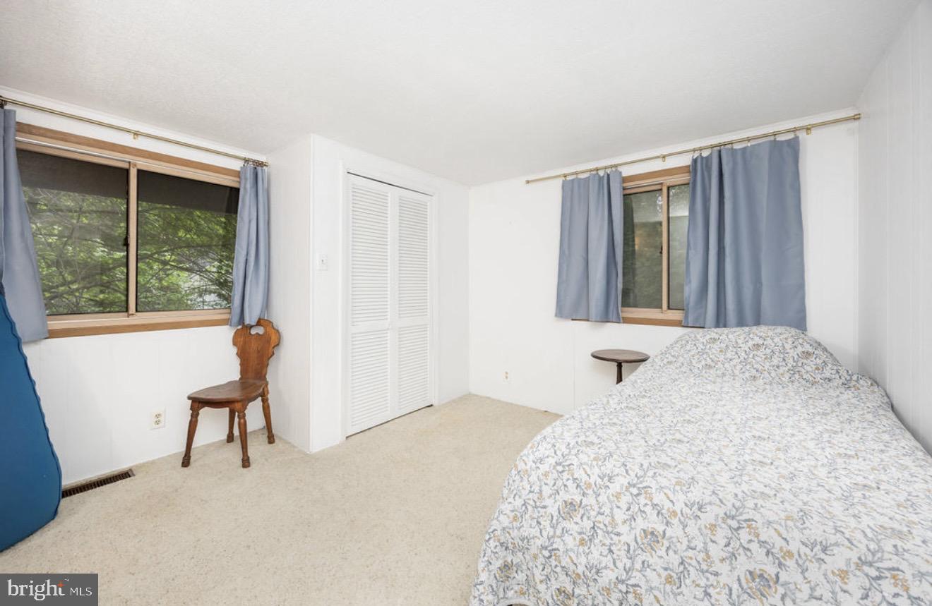 5 Falcon Bridge Road Ocean Pines, MD 21811 - Photo 25 of 59 a bedroom with a bed and a window