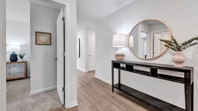 a view of living room with wooden floor