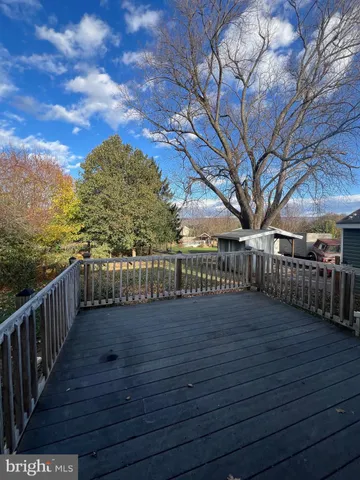 a view of a balcony with trees