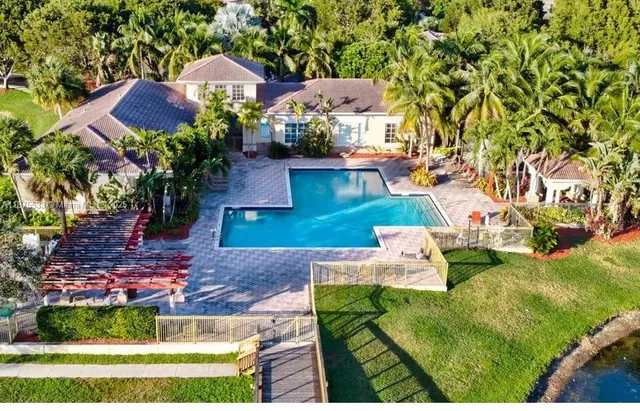 an aerial view of a house with a garden