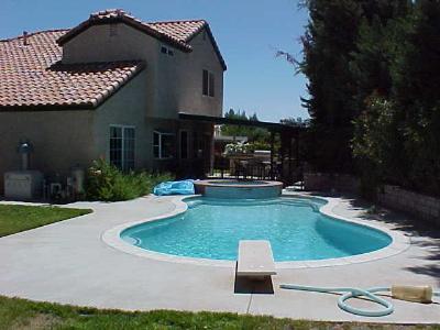 1622 Kings Road Palmdale, CA 93551 - Photo 3 of 3 a front view of a house with garden