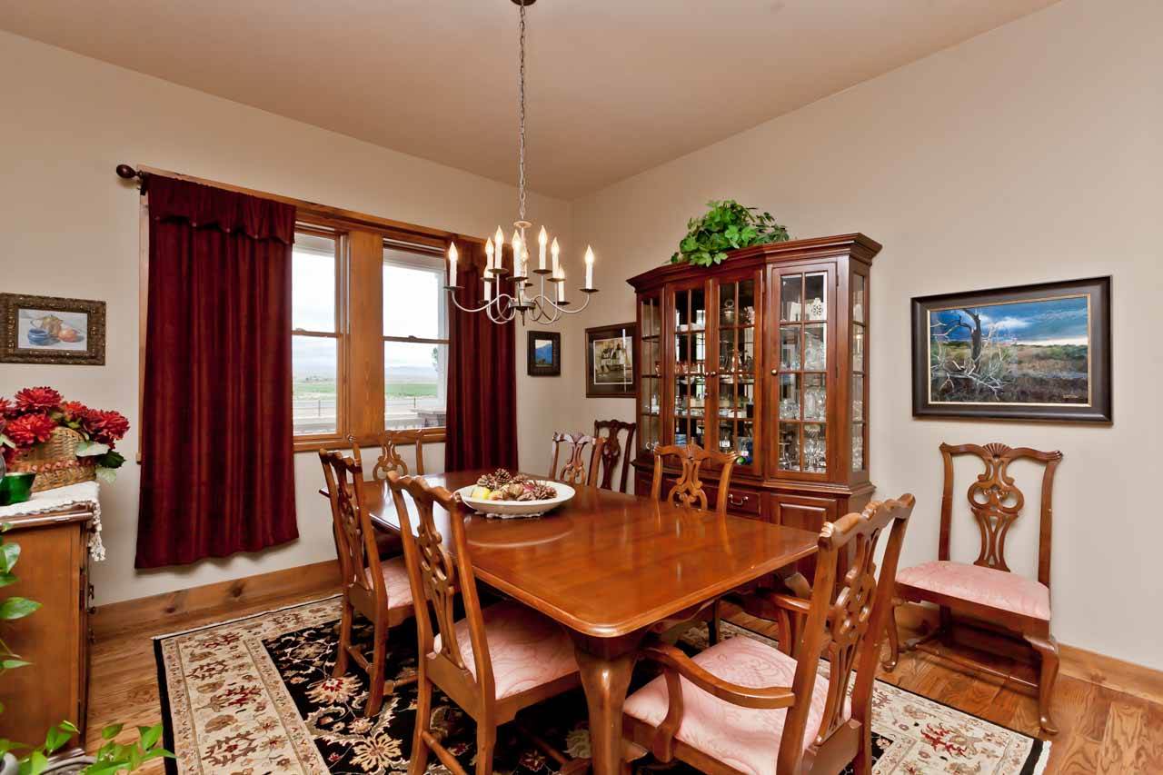 1355 Saddle Ridge Road Loma, CO 81524 - Photo 12 of 36 a dining room with furniture a chandelier and wooden floor