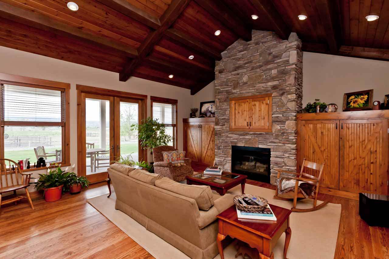 1355 Saddle Ridge Road Loma, CO 81524 - Photo 15 of 36 a living room with furniture a fireplace and a table