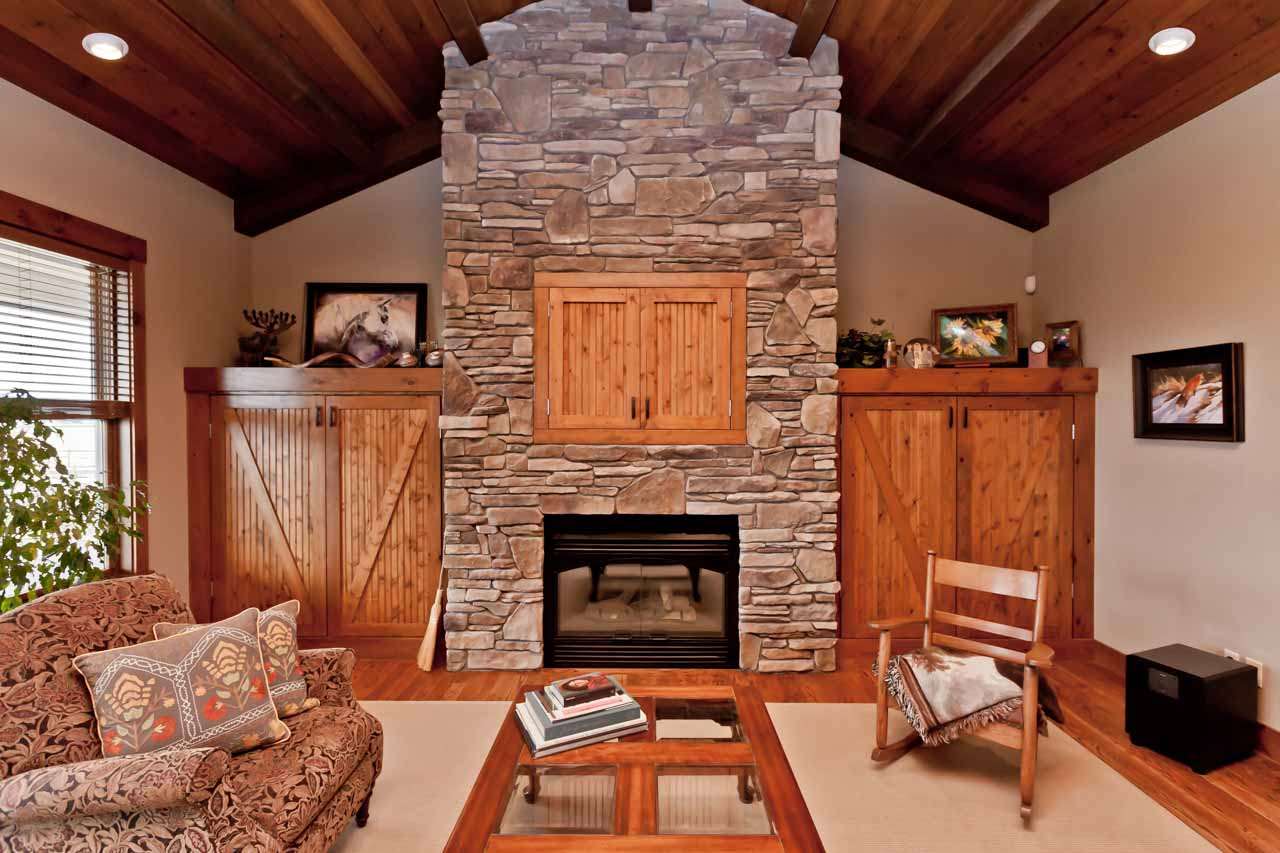 1355 Saddle Ridge Road Loma, CO 81524 - Photo 16 of 36 a living room with furniture a fireplace and a table