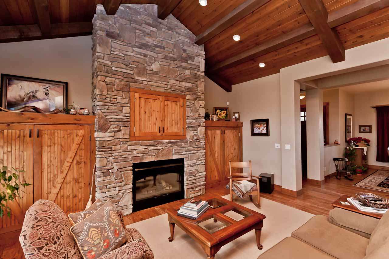 1355 Saddle Ridge Road Loma, CO 81524 - Photo 17 of 36 a living room with furniture and a fireplace