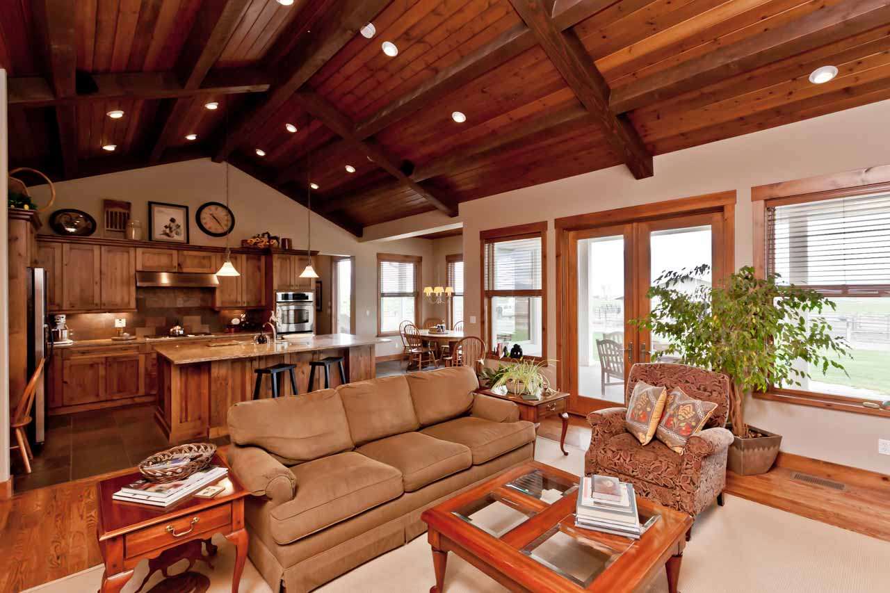 1355 Saddle Ridge Road Loma, CO 81524 - Photo 20 of 36 a living room with furniture a large window and a fireplace