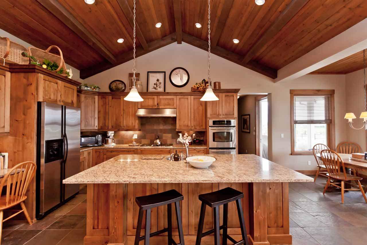 1355 Saddle Ridge Road Loma, CO 81524 - Photo 23 of 36 a large kitchen with a table and chairs