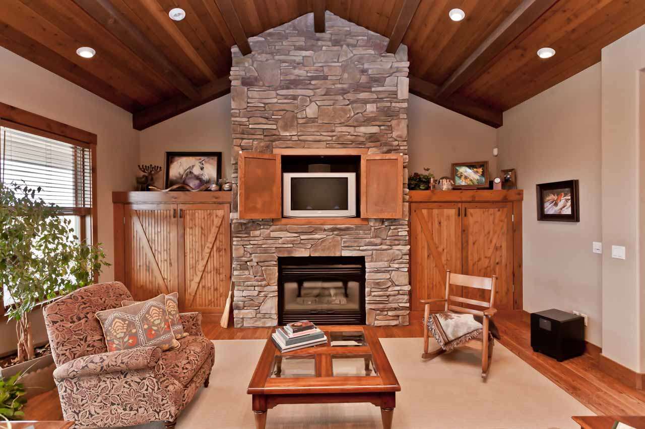 1355 Saddle Ridge Road Loma, CO 81524 - Photo 24 of 36 a living room with furniture and a fireplace