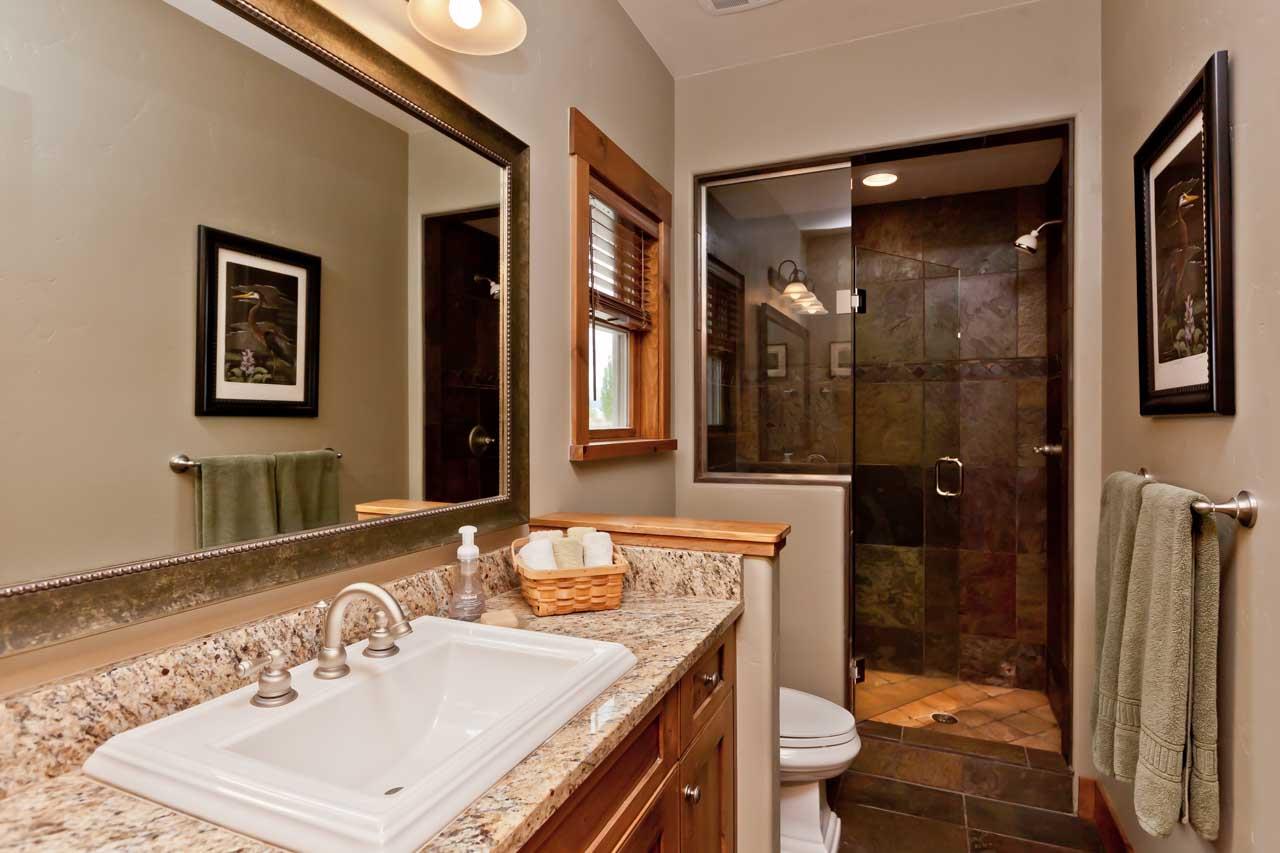 1355 Saddle Ridge Road Loma, CO 81524 - Photo 26 of 36 a bathroom with a sink a toilet and shower