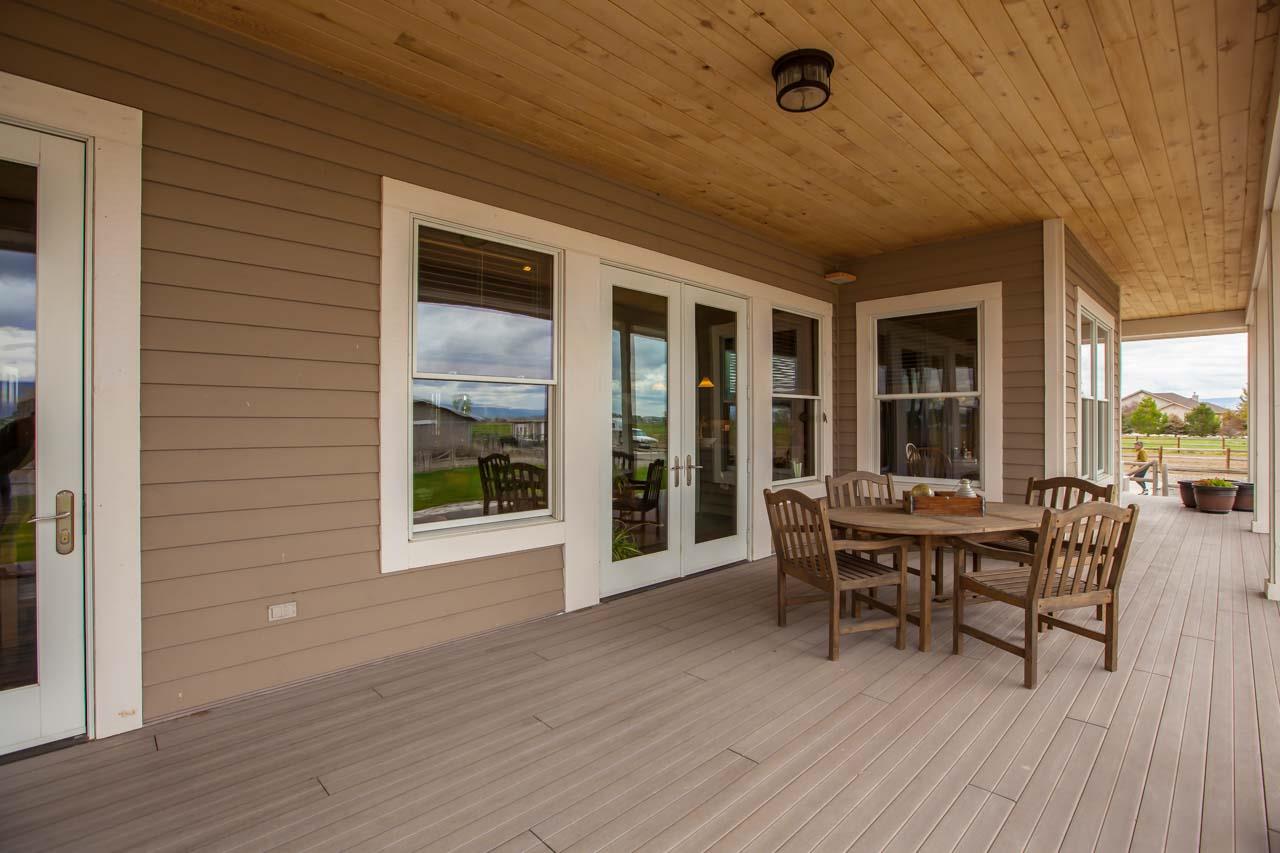 1355 Saddle Ridge Road Loma, CO 81524 - Photo 33 of 36 a view of a patio with table and chairs and wooden floor