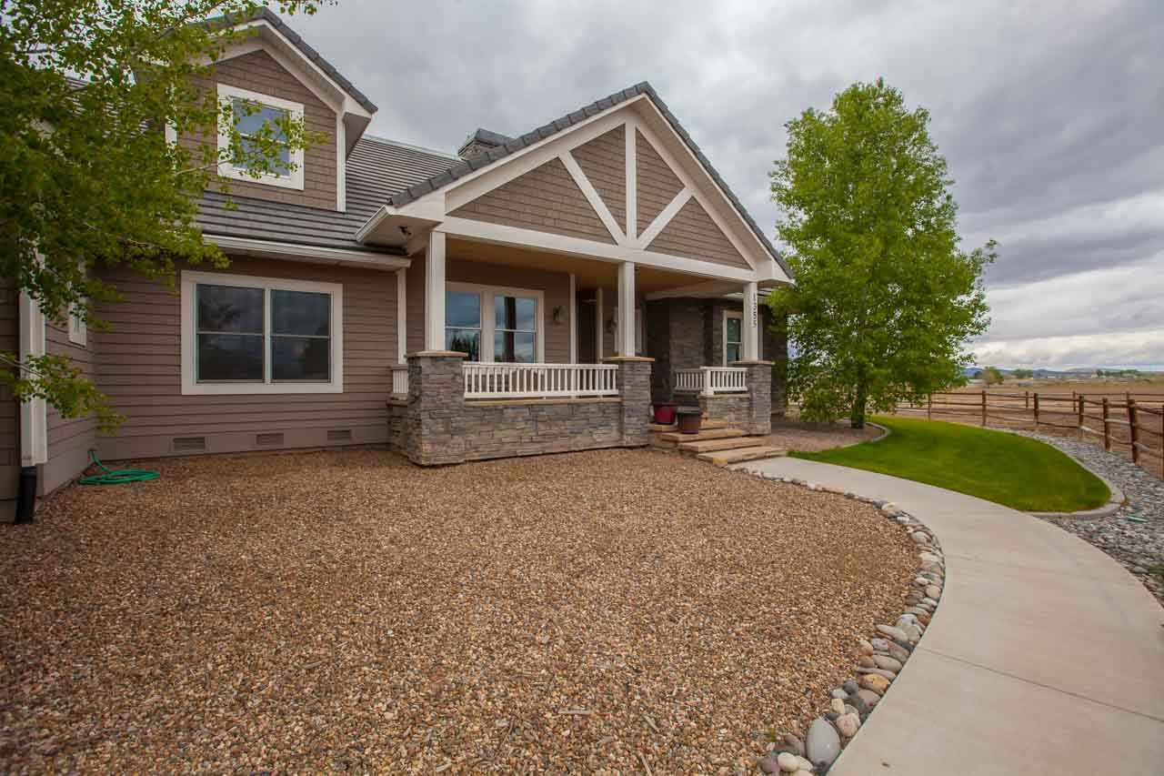 1355 Saddle Ridge Road Loma, CO 81524 - Photo 34 of 36 front view of a house with a porch
