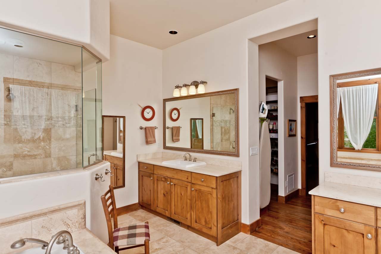 1355 Saddle Ridge Road Loma, CO 81524 - Photo 4 of 36 a spacious bathroom with a tub sink and mirror