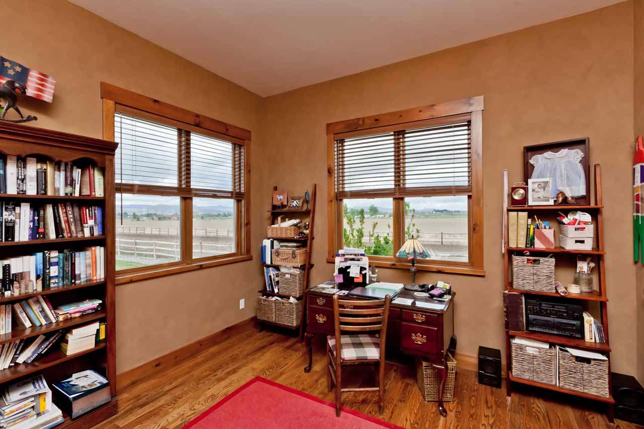 1355 Saddle Ridge Road Loma, CO 81524 - Photo 6 of 36 a living room with furniture a bookshelf and a window
