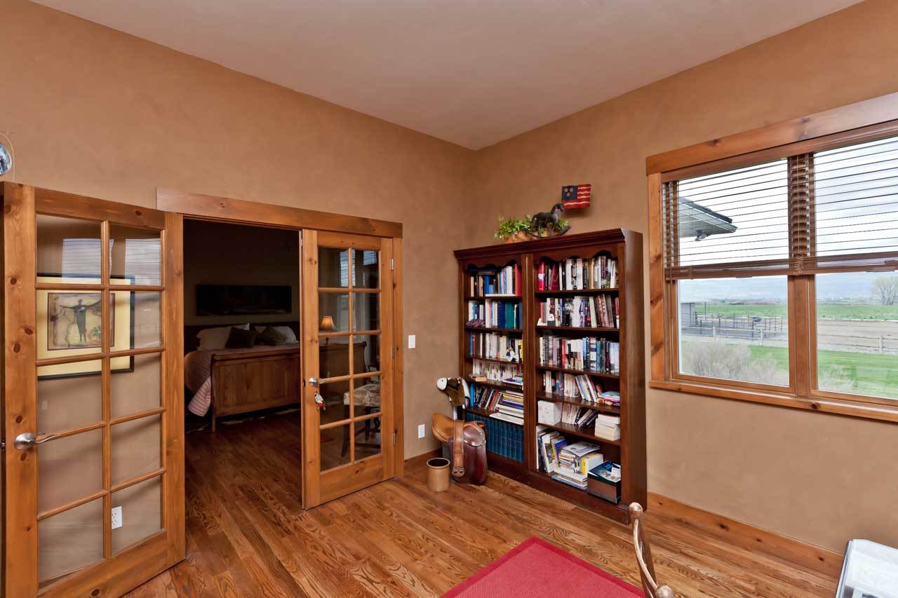 1355 Saddle Ridge Road Loma, CO 81524 - Photo 7 of 36 a view of an empty room with window and wooden floor