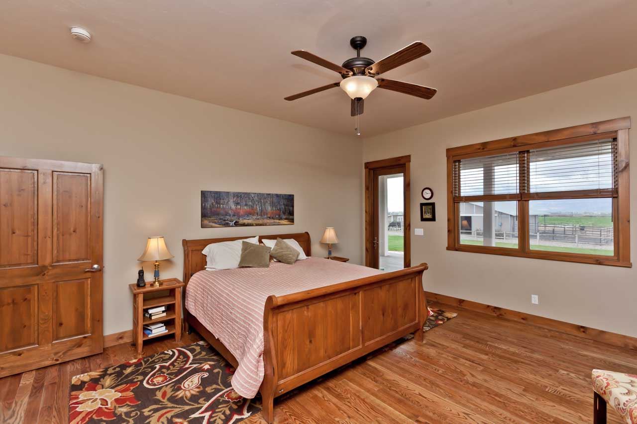 1355 Saddle Ridge Road Loma, CO 81524 - Photo 8 of 36 a bedroom with a large bed and a window