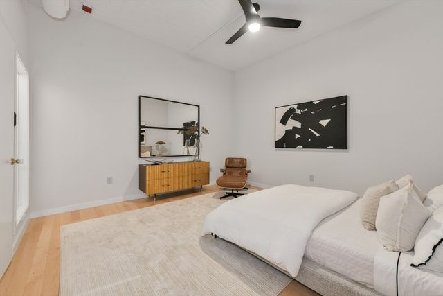 a bedroom with bed and window