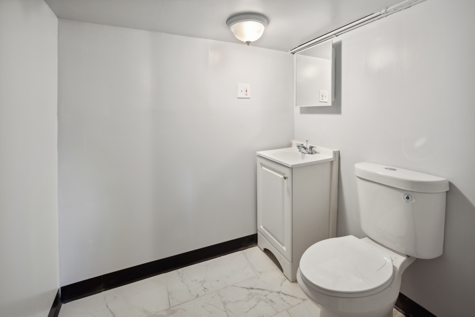 5918 South Carpenter Street Chicago, IL 60621 - Photo 14 of 15 a bathroom with a toilet and a sink
