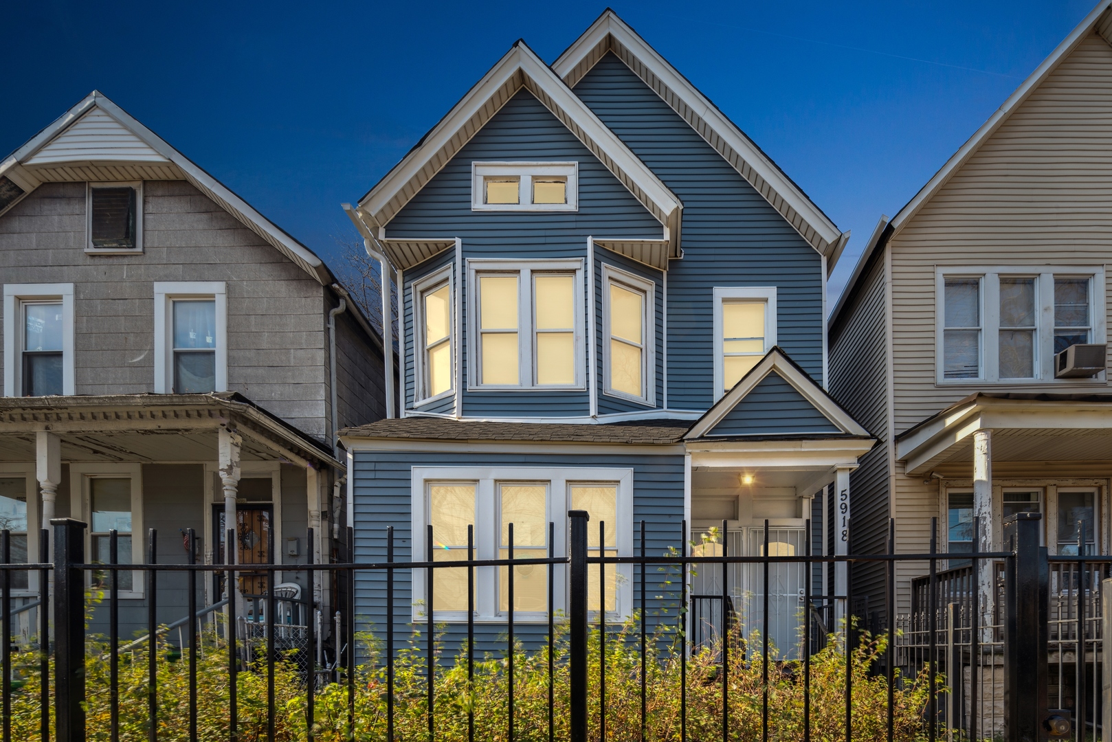 5918 South Carpenter Street Chicago, IL 60621 - Photo 15 of 15 a front view of a house with a yard