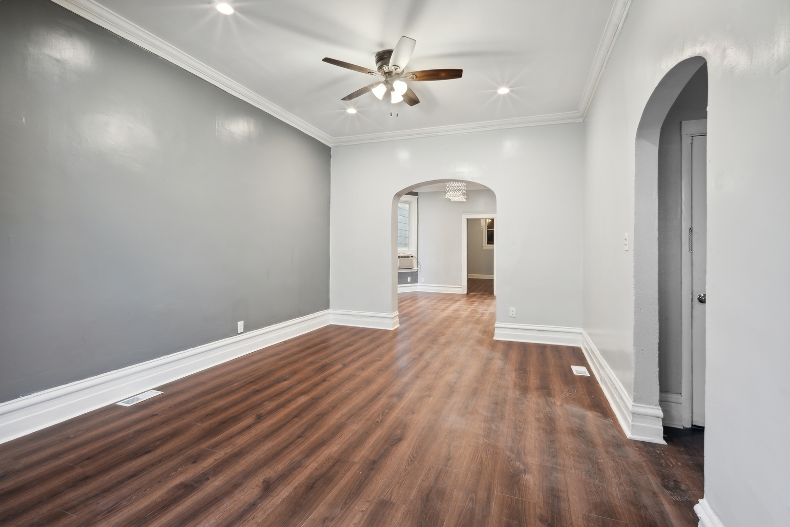 5918 South Carpenter Street Chicago, IL 60621 - Photo 3 of 15 wooden floor in an empty room with a window