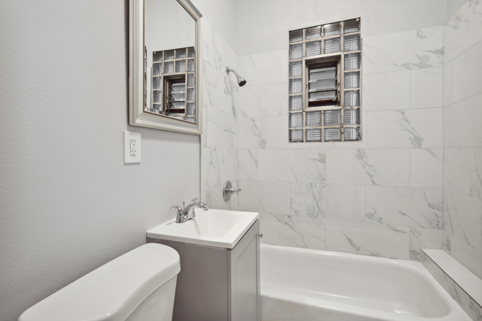 5918 South Carpenter Street Chicago, IL 60621 - Photo 5 of 15 a bath room with a toilet and a bath tub