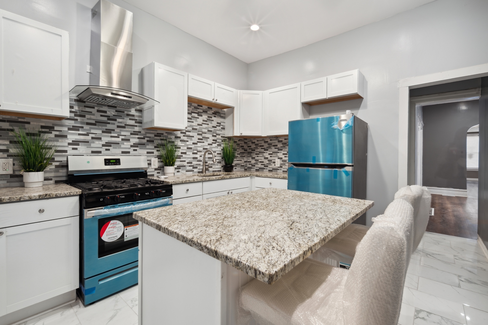 5918 South Carpenter Street Chicago, IL 60621 - Photo 6 of 15 a kitchen with a stove and a refrigerator