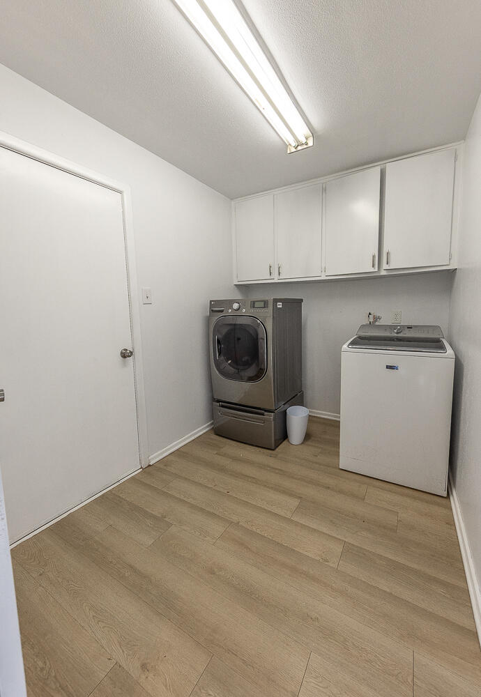 3613 58th Street Lubbock, TX 79413 - Photo 15 of 20 a room with a bed and cabinets