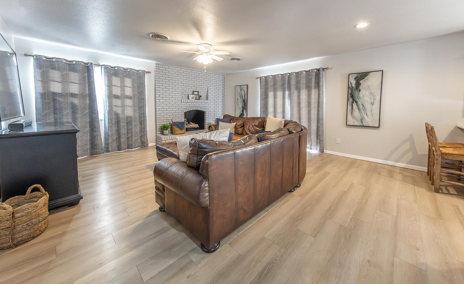 3613 58th Street Lubbock, TX 79413 - Photo 2 of 20 a living room with furniture and a large window
