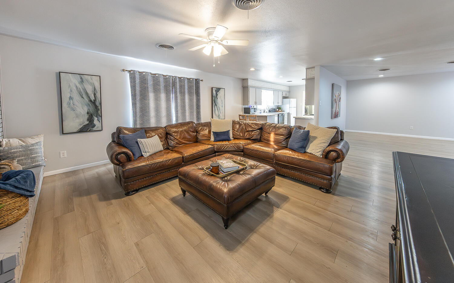 3613 58th Street Lubbock, TX 79413 - Photo 4 of 20 a living room with furniture and a ceiling fan