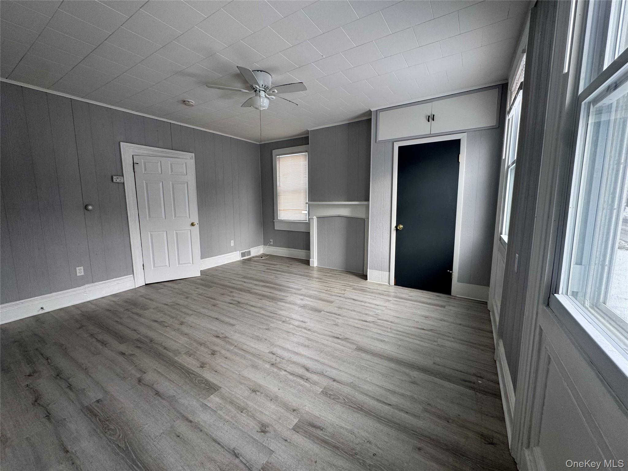 34 Hoffman Street, Unit 2 Poughkeepsie, NY 12601 - Photo 2 of 7 a view of empty room with wooden floor