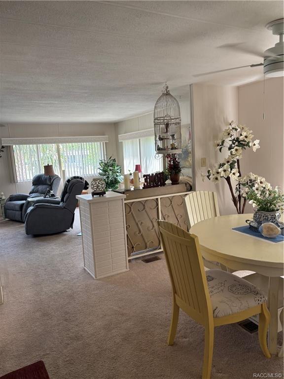 14334 Midfield Street Brooksville, FL 34613 - Photo 16 of 48 a dining room with furniture and window