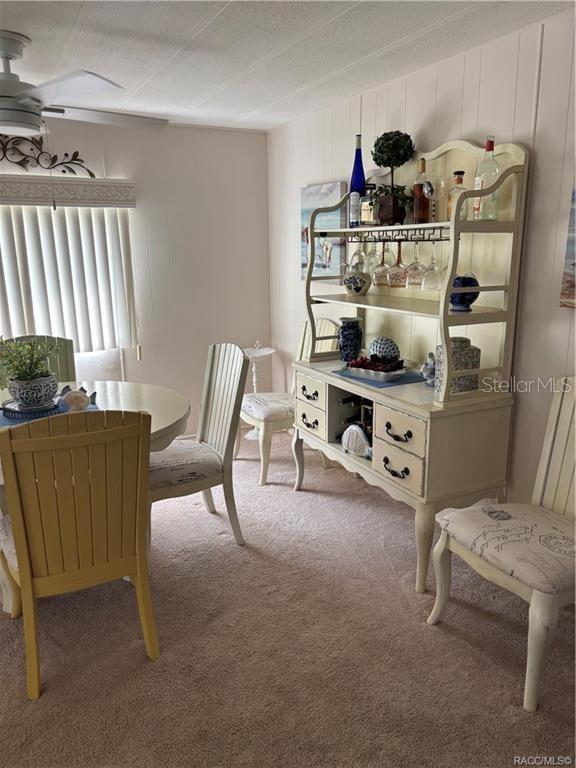 14334 Midfield Street Brooksville, FL 34613 - Photo 17 of 48 a living room with furniture and a table