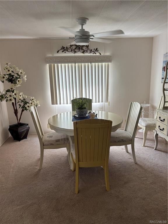 14334 Midfield Street Brooksville, FL 34613 - Photo 18 of 48 a living room with furniture and a large window