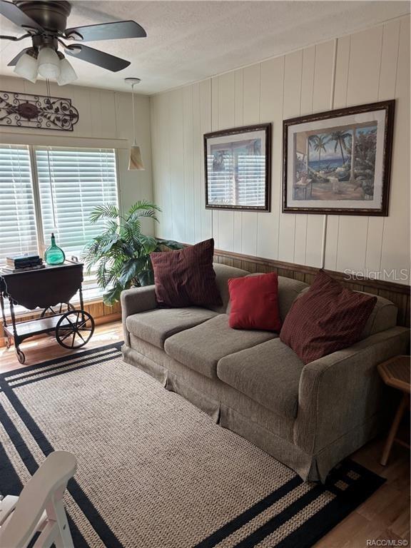 14334 Midfield Street Brooksville, FL 34613 - Photo 19 of 48 a living room with furniture and a large window