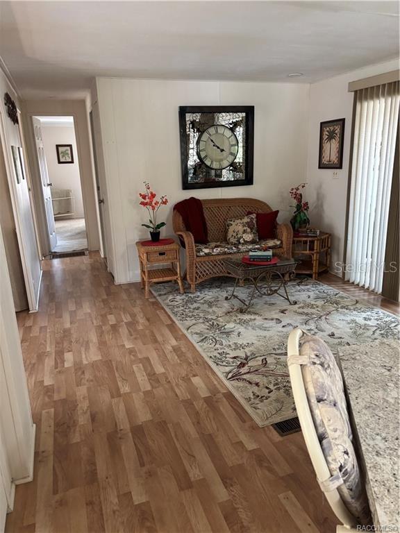 14334 Midfield Street Brooksville, FL 34613 - Photo 23 of 48 a living room with furniture and a flat screen tv